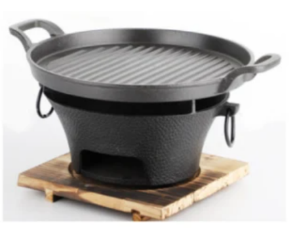 Forging Flavor In A Cast Iron BBQ Grill&#039;s Fire